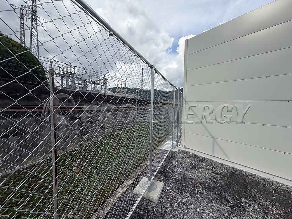 Completed on‑site welded mesh security fence perimeter view Completed on‑site welded mesh security fence perimeter view
